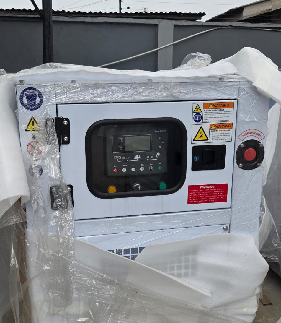 Engineer installing 30kVA Perkins generator for duplex home in Nigeria